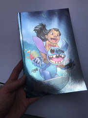 Photo of a hand holding the foil cover variant of David Nakayama's cover for Lilo & Stitch #1