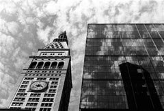 35mm B&W photo shot with this camera of a clocktower and building in NYC framed against a bright cloud dappled sky