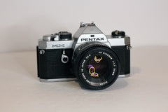 Pentax MX 35mm camera with a Ricoh Rikenon 50mm f1.7 lens